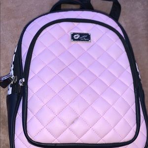 white and pink bad with 3 pockets